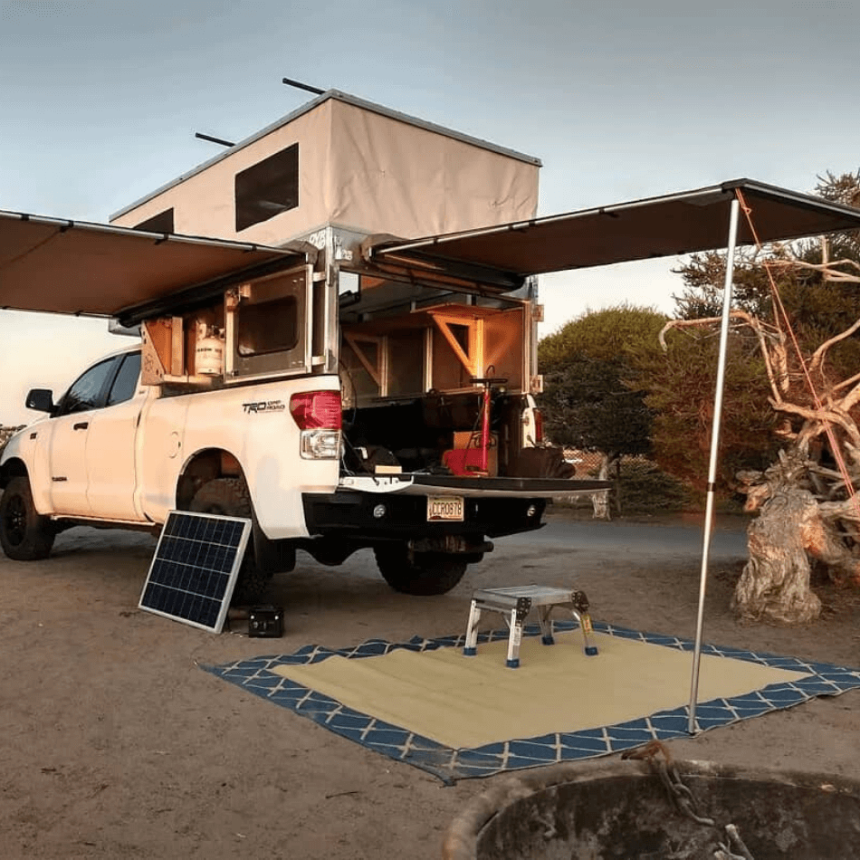 12 Of the Best Small Truck Campers On the Market Right Now 12 OVRLND Custom Pop Top Camper Shell Open Panel