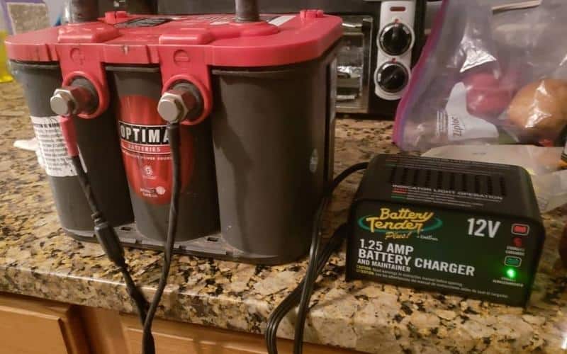 Charge The RV Battery With A Battery Or Smart Charger Plugged Into Shore Power