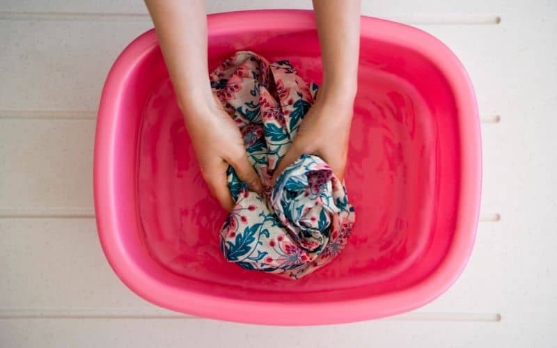 6 Ways to Do RV Laundry While Living Full Time On the Road! 6 Hands washing laundry