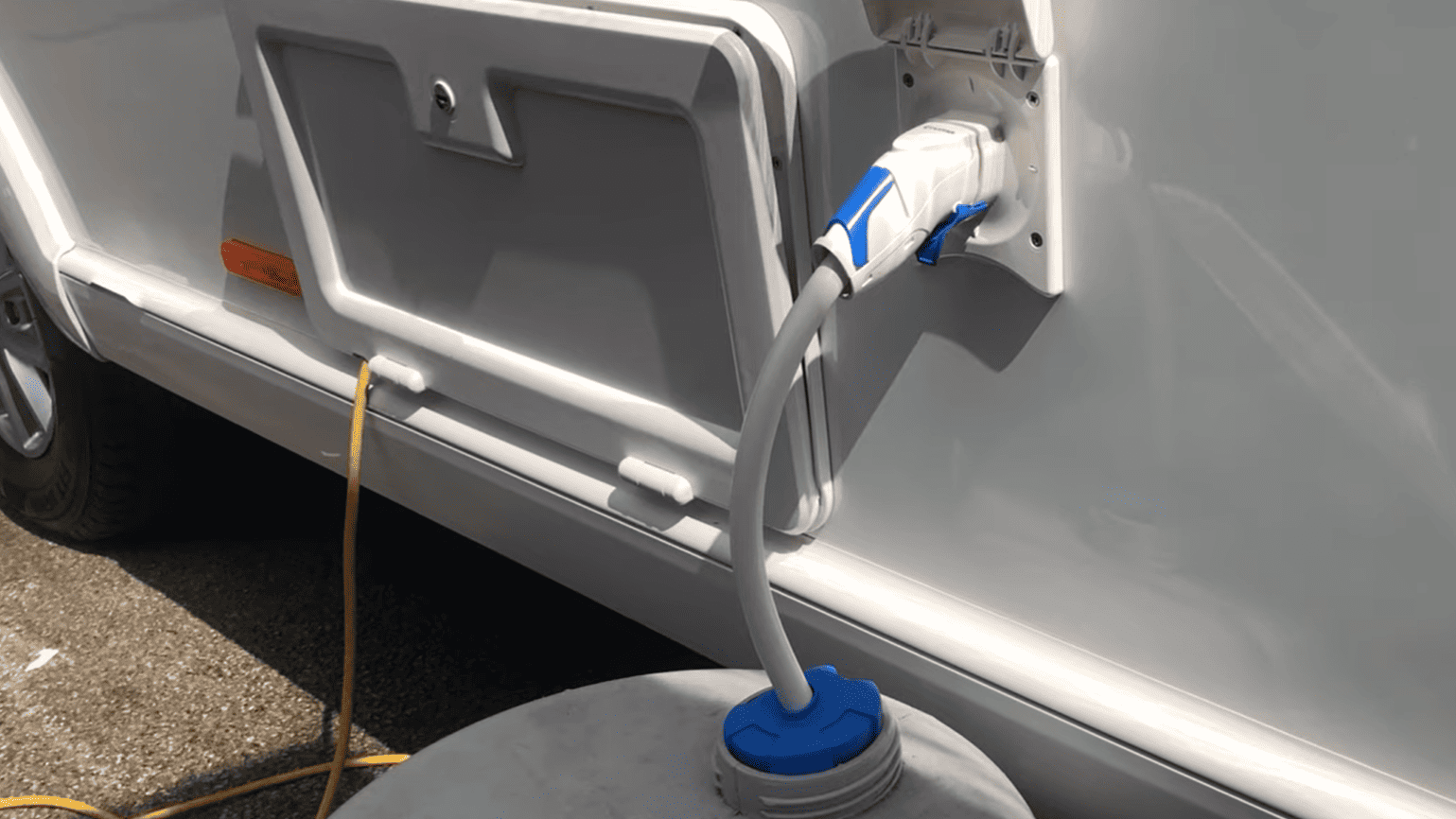Image showing the process of filling up an RV's freshwater storage tank.