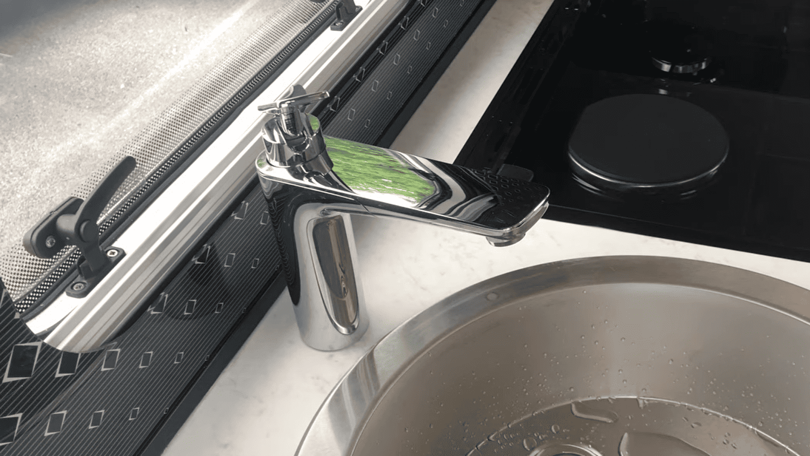 Image showing the RV kitchen tap opened. 