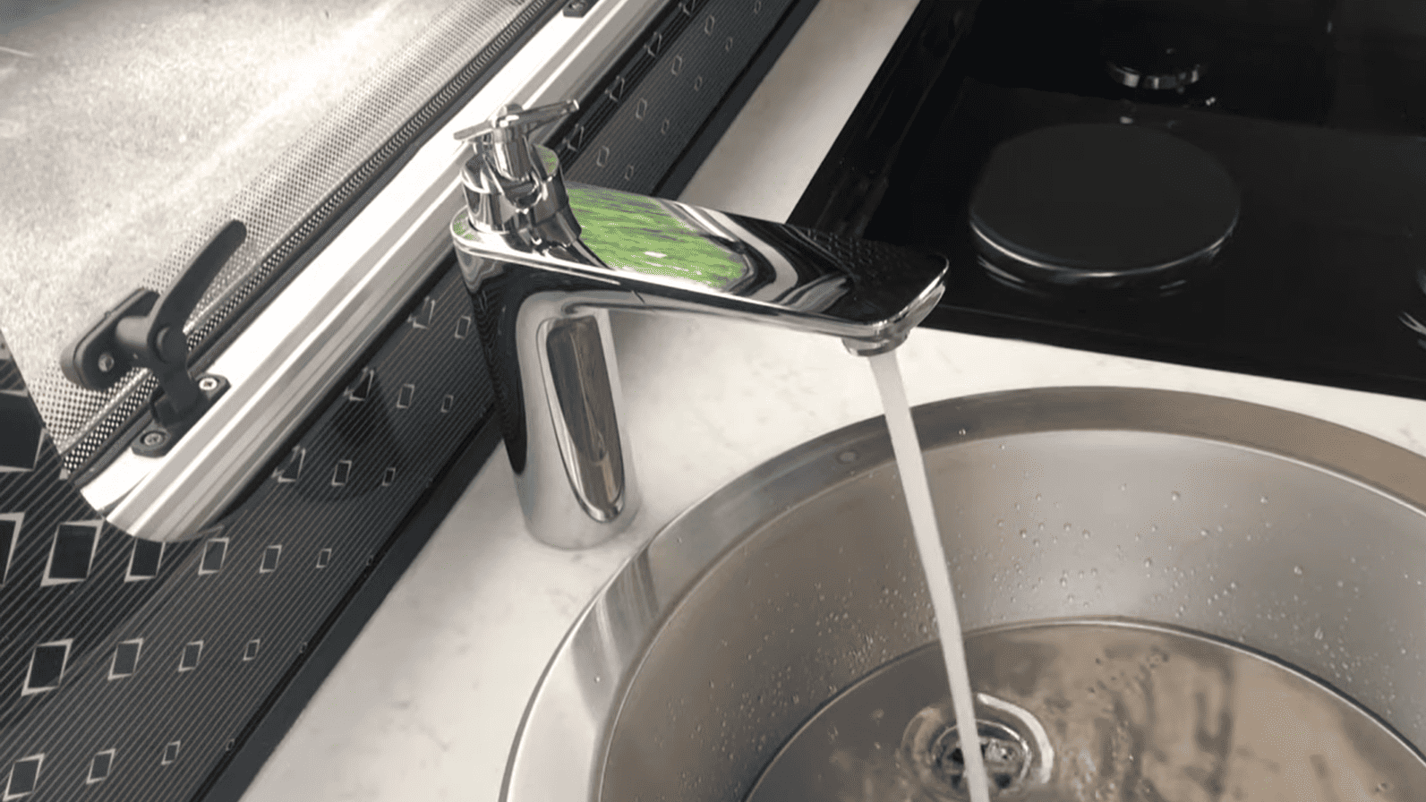 Image showing water flowing through the kitchen tap.