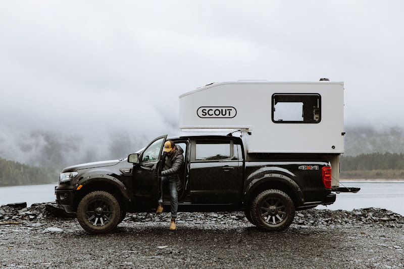 Top 7 Amazing Truck Campers For The Toyota Tacoma 2 Scout Yoho 6.0 truck camper mounted on a pickup truck beside a lake